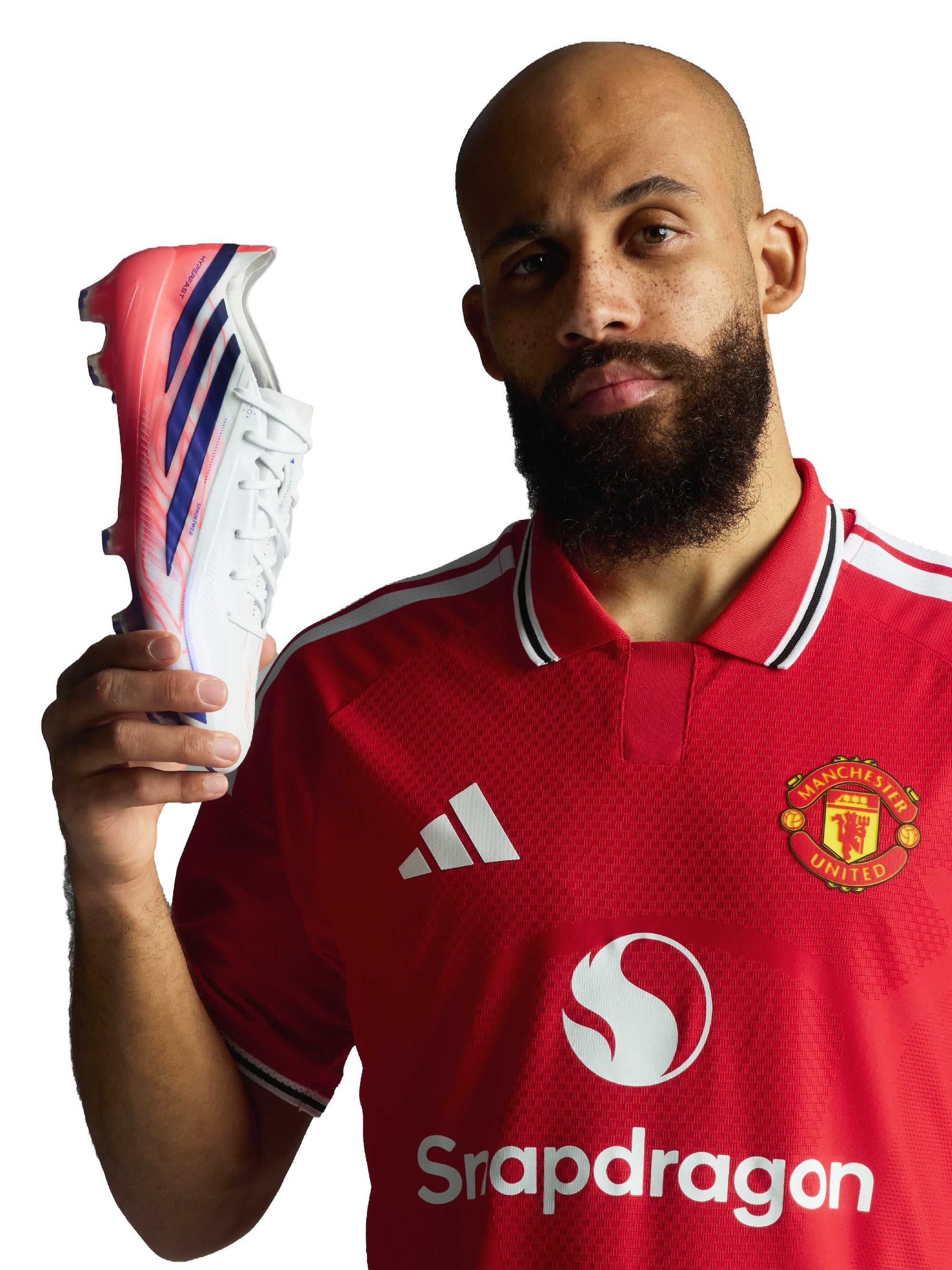 Bryan Mbeumo wearing Manchester United's 26/27 Home jersey & holding adidas F50 Elite "Chaos vs Control" Boots. Photo via adidas.