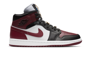 Women's Air Jordan 1 Mid in a "Black/White/Hyper Royal/Dark Beetroot" color scheme, complete with golden charms.