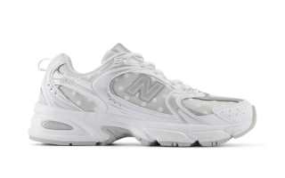 Women's polka dot-covered New Balance 530 in a clean "White/Silver Metallic" color scheme.