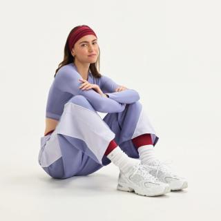 Model wearing Women's New Balance 530 "Polka Dots" (White/Silver Metallic). Photo via New Balance.