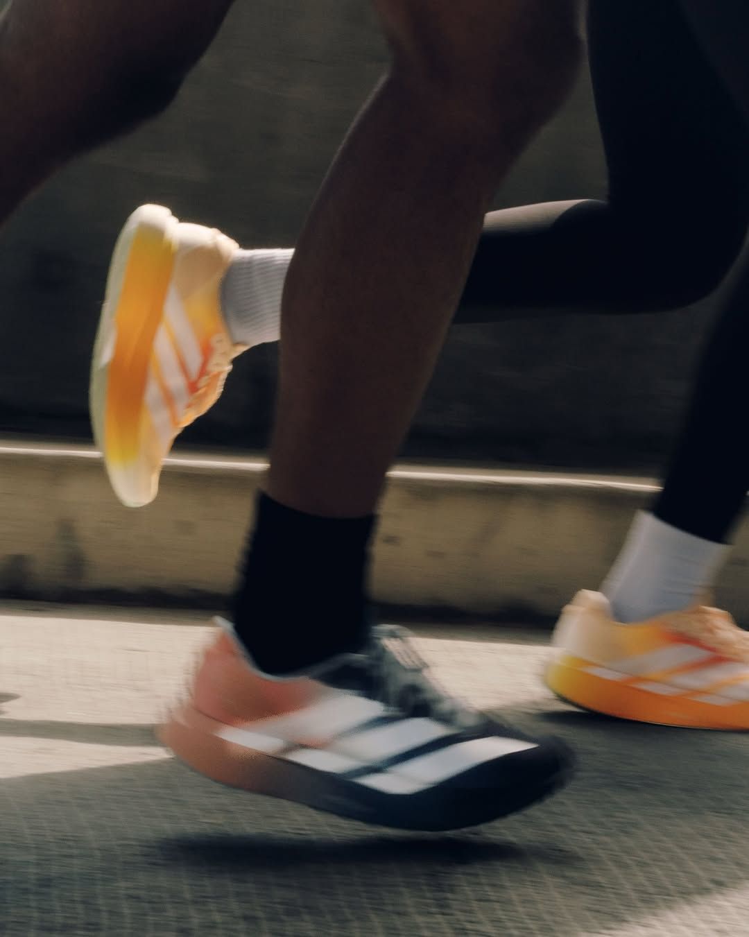 The Whitaker Group's two adidas Adizero Evo SL "Do Not Duplicate" collaborations.