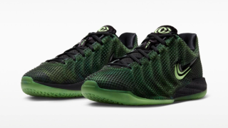 Caitlin Clark showing off Nike Caitlin 1 "Halloween" basketball shoe in a "Black/Ghost Green/Mint Foam/Racer Blue" color scheme.