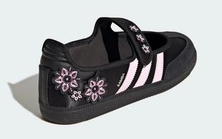 Women's adidas Samba Jane in a "Core Black/Clear Pink/Silver Metallic" color scheme, complete with flower patches on the heel & strap.