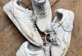 Distressed pairs of CELINE's premium white Reebok sneaker collaboration.