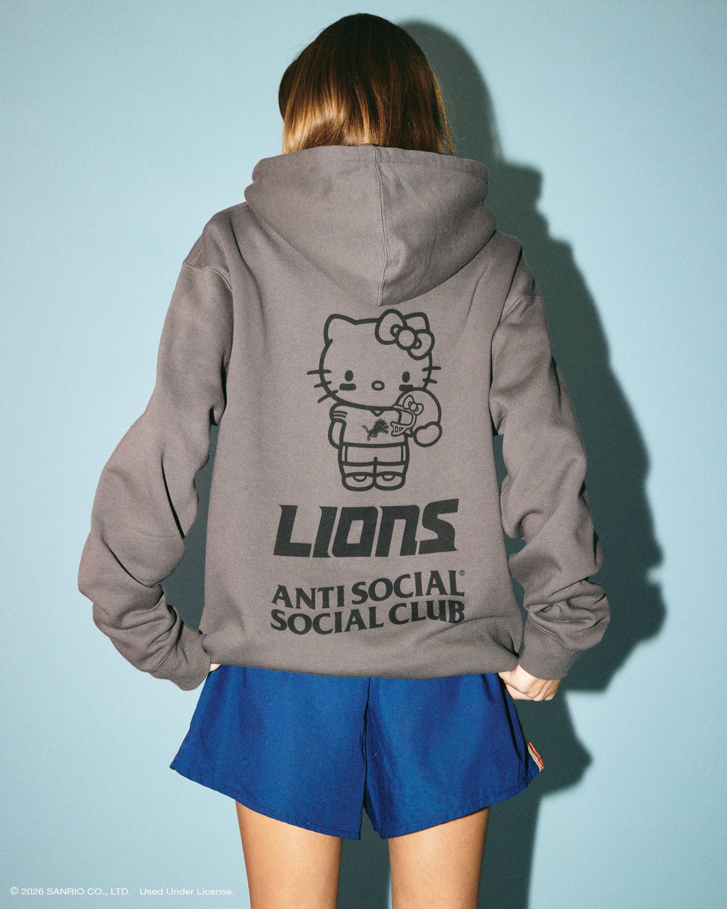 Anti Social Social Club × Hello Kitty NFL collection: grey Detroit Lions hoodie with Hello Kitty graphic, lookbook photo via House of Heat