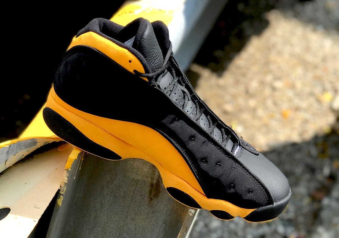 Jordan 13 black hot sale yellow red