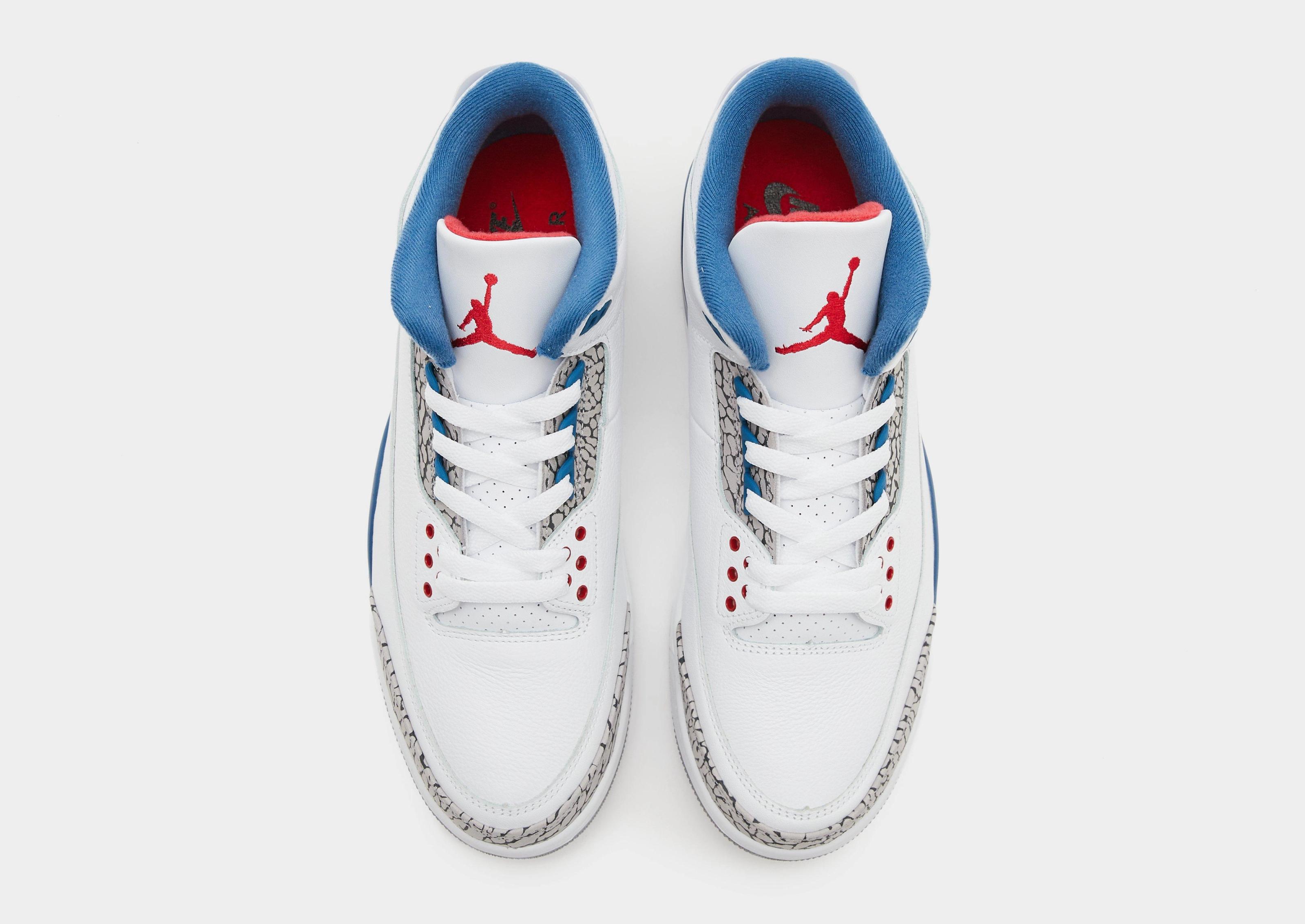 Air Jordan 3 Retro True Blue tongue detail showing Fire Red Jumpman branding