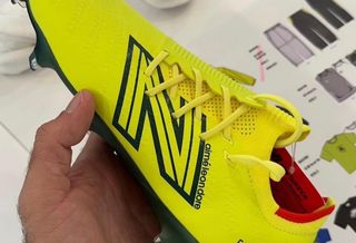 Teddy Santis teases a neon yellow pair of the New Balance Furon football boots as part of a collection ahead of the 2026 World Cup™.