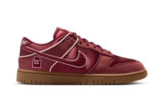 Kobe Bryant's Nike Dunk Low "Lower Merion" in a mostly team red color scheme.
