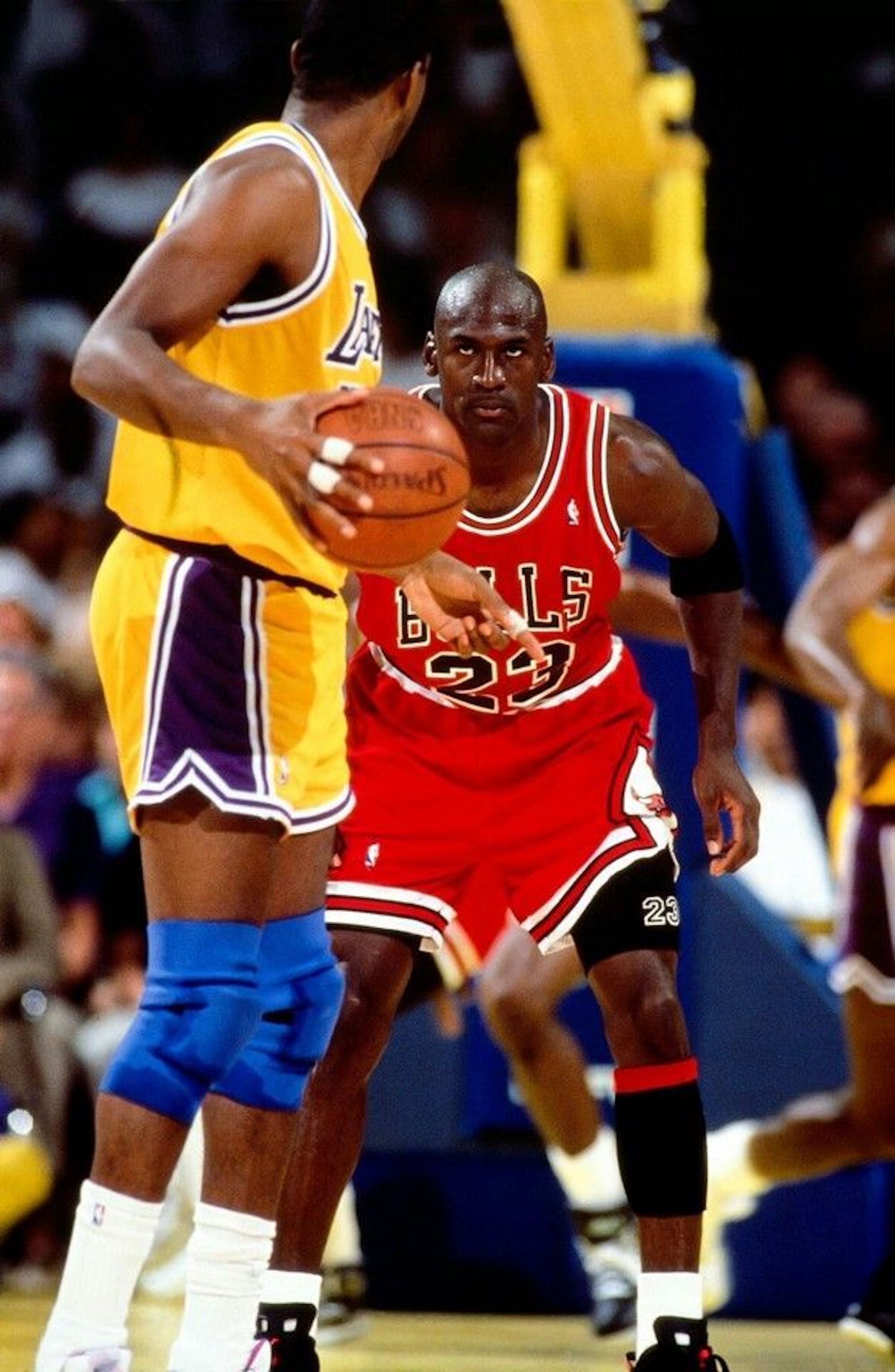Michael Jordan defending against Magic Johnson in Game 5 of the 1991 NBA Finals against the Los Angeles Lakers. 
