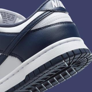 Heel close-up of Women's Nike Dunk Low covered in a "White/Thunder Blue" color scheme.