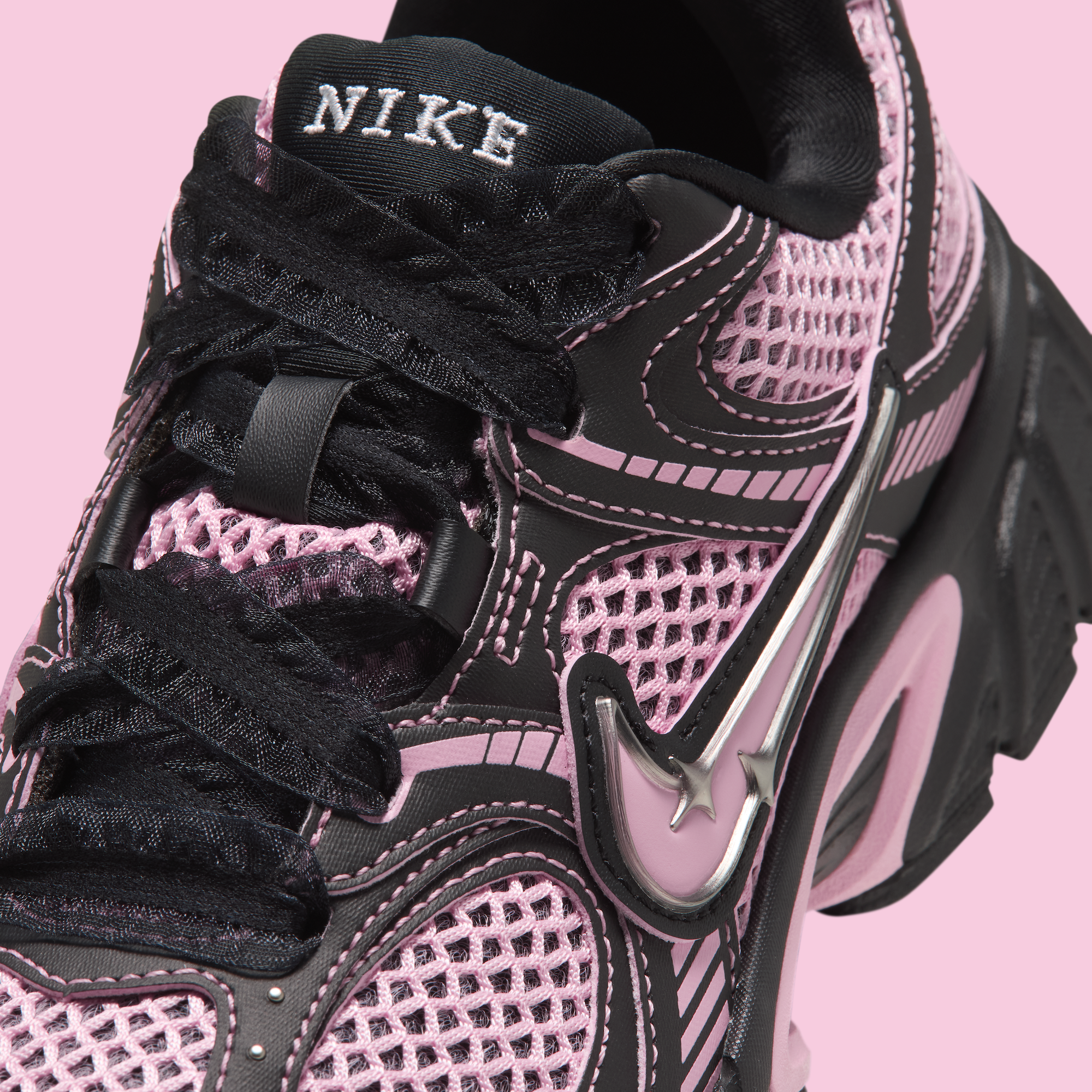Women's Nike V5 RNR $95 retro runner-inspired sneaker in a "Black/Metallic Silver/Medium Soft Pink" color scheme.