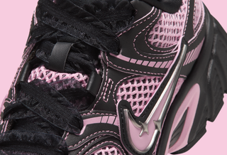 Women's Nike V5 RNR $95 retro runner-inspired sneaker in a "Black/Metallic Silver/Medium Soft Pink" color scheme.