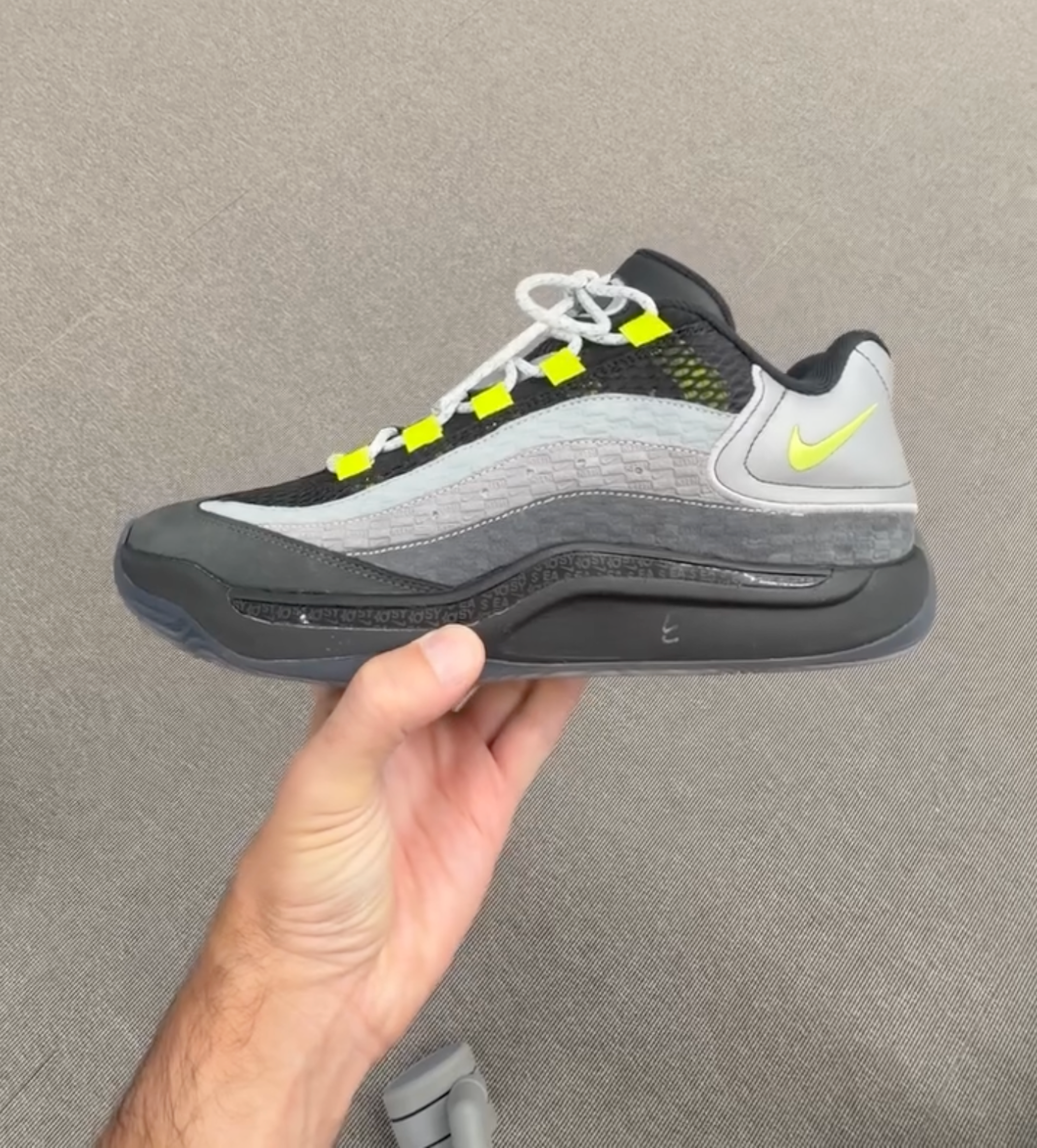 Kevin Durant's Nike KD 18 in a neon yellow and grey color scheme inspired by the Nike Air Max 95. The collab is with Ronnie Fieg's Kith.