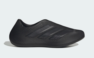 Adidas Purechill recovery slip-on in a "Core Black/Carbon/Carbon" color scheme.