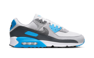 Nike's Air Max 90 in a "Platinum Tint/Blue Lightning" color scheme.