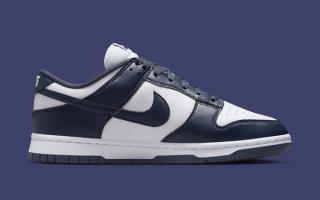 Medial angle of Women's Nike Dunk Low covered in a "White/Thunder Blue" color scheme.