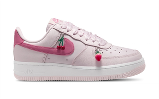 Valentine's Day-inspired Nike Air Force 1 Low in a "Pearl Pink" color scheme, complete with fruit-shaped charms.