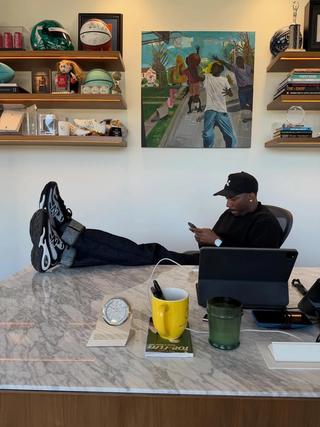 Rich Paul wearing a Klutch Sports x New Balance AC Runner collab in black and white.