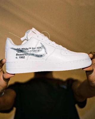 Virgil Abloh holding an Off-White™ x Nike Air Force 1 collaboration. Photo via Nike.