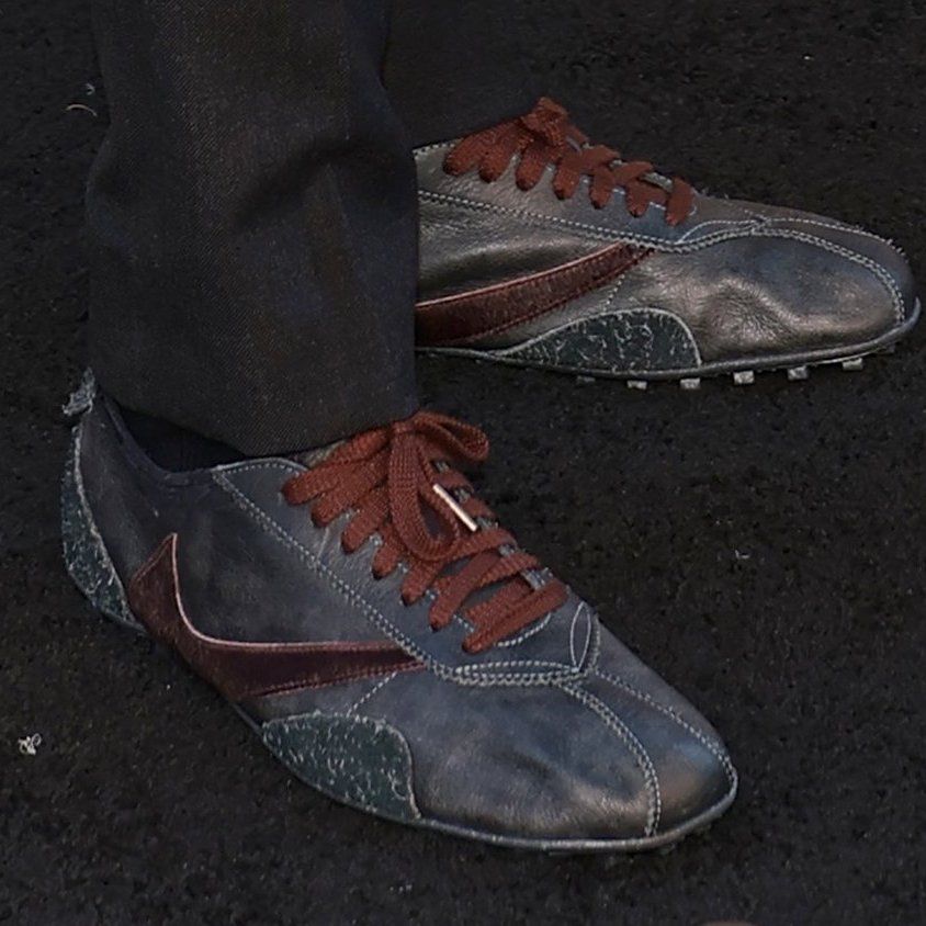 Detail shot of the unreleased Nike Moon Shoe collab, showing the reverse Swoosh and burgundy laces
