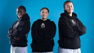 GG Banks, Jordyn Palmer & Jessie Moses wearing the Playa Society x Overtime "BELIEVE" Hoodie. Photo via Overtime.