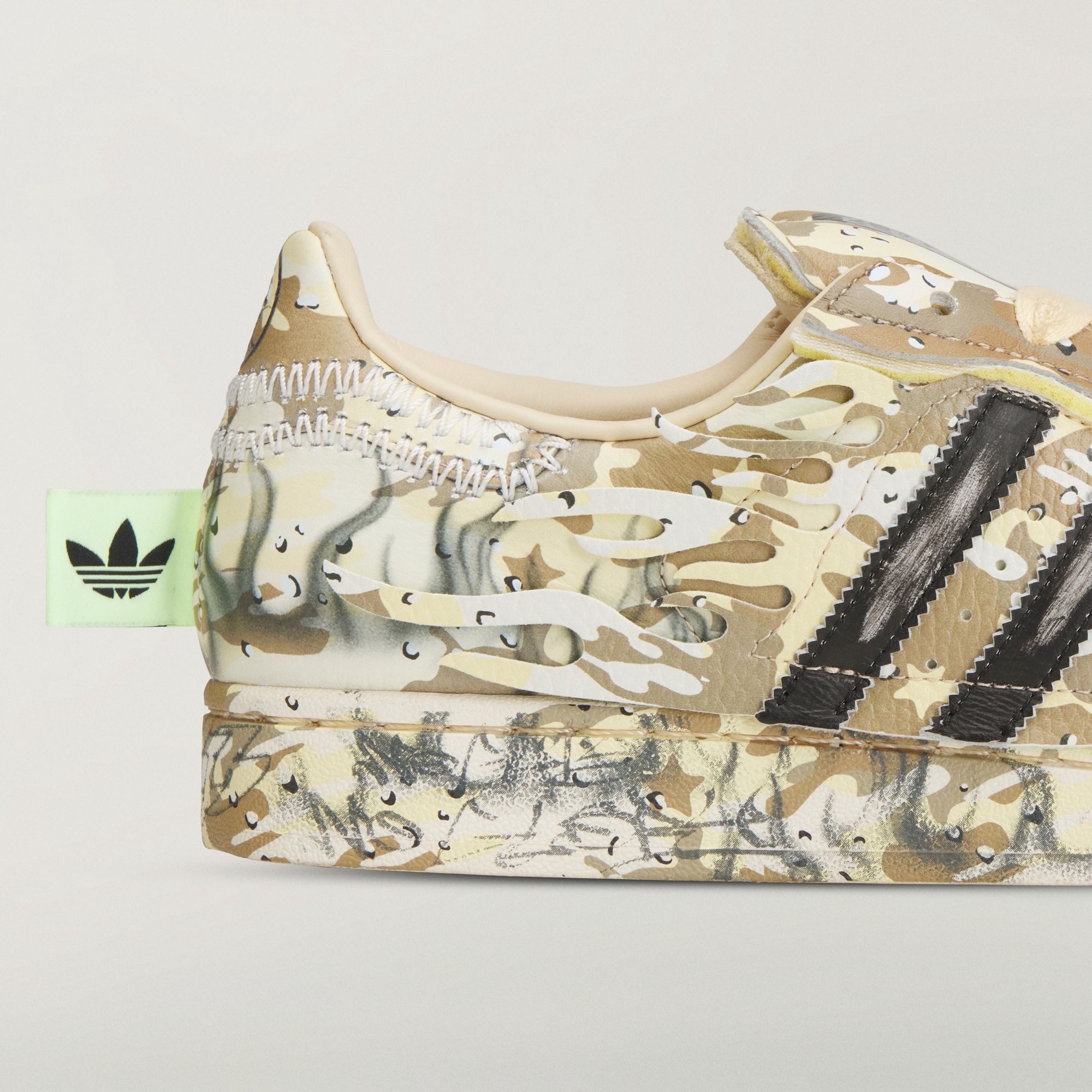 HELLSTAR x adidas Superstar collaboration in a "Warm Sandstone" camouflage.