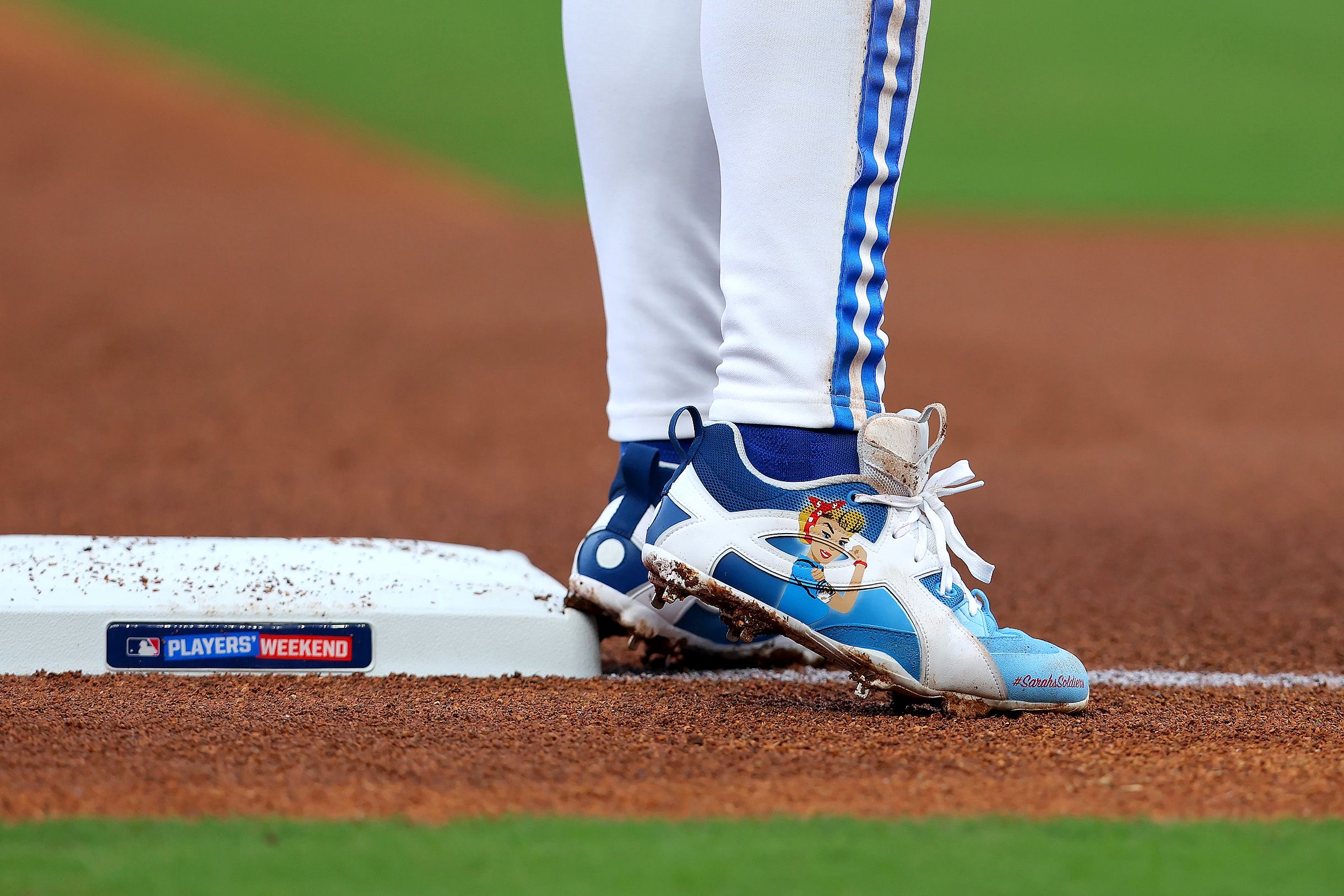 Bobby Witt Jr.'s Rosie the Riveter Under Armour Custom Cleats. Photos via MLB.