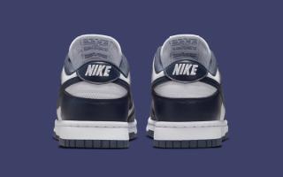Heel angle of Women's Nike Dunk Low covered in a "White/Thunder Blue" color scheme.