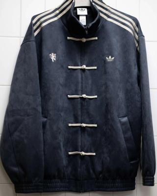 Manchester United players wearing custom viral adidas Chinese New Year Jacket in grey on May 9, 2026.