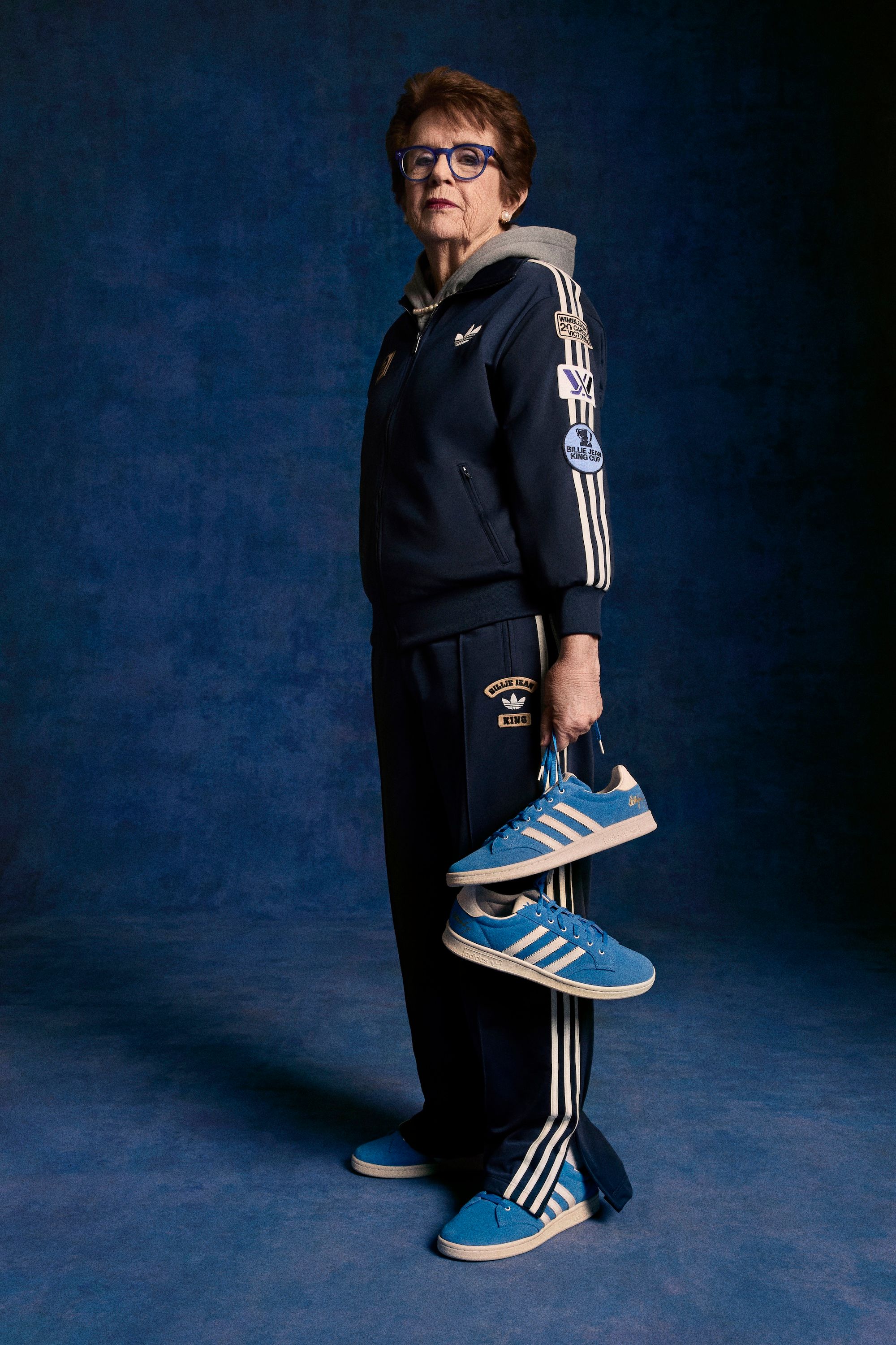 Billie Jean King posting with her adidas Tennis Blue Suede Shoes re-release. Photo via adidas.