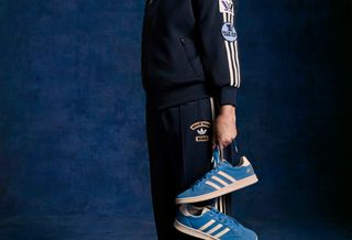 Billie Jean King posting with her adidas Tennis Blue Suede Shoes re-release. Photo via adidas.