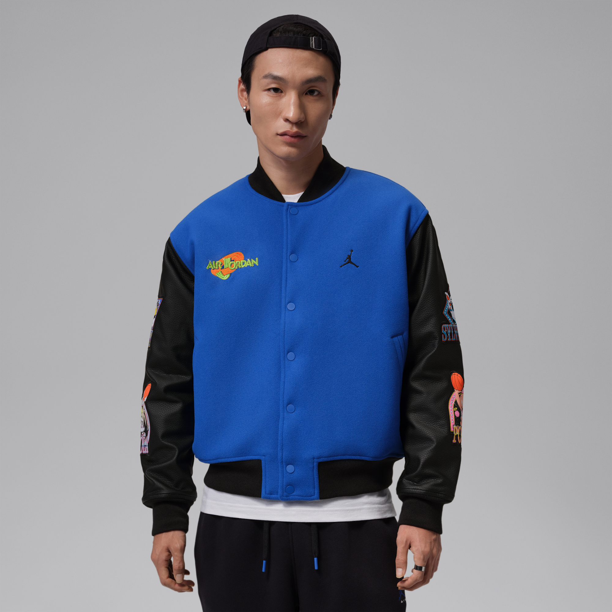 Jordan Flight Space Jam Men's Varsity Jacket "30th Anniversary" release, featuring a "Varsity Royal/Black" color scheme & patches dedicated to the Looney Tunes Squad.