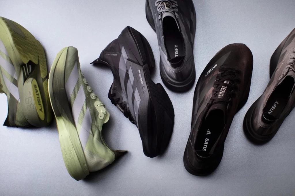 Satisfy and Adidas running shoe collaboration featuring minimalist Swiss design aesthetic and three-stripe branding