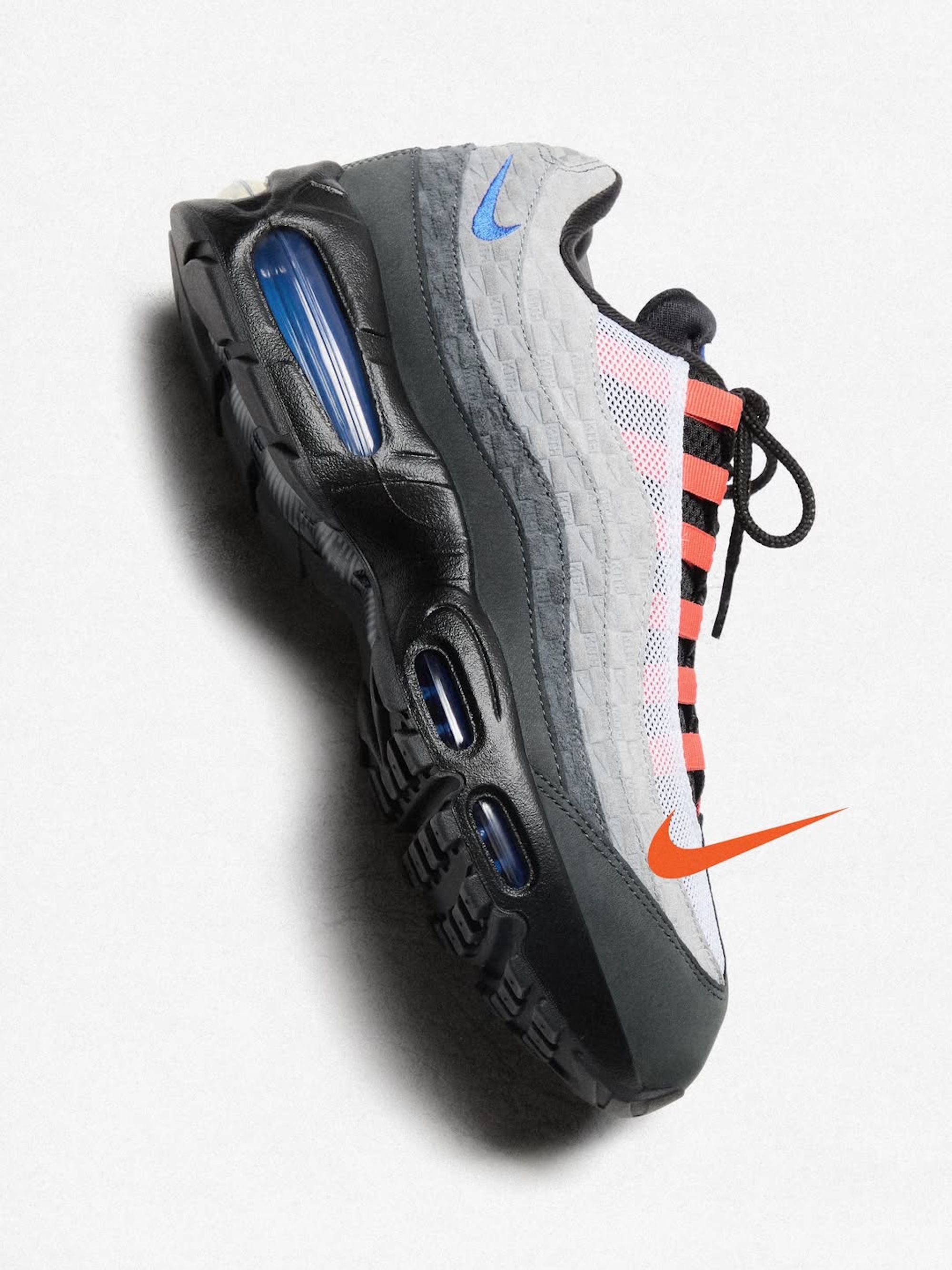 A grey, blue, and orange-colored Kith x Nike Air Max 95.