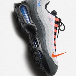 A grey, blue, and orange-colored Kith x Nike Air Max 95.