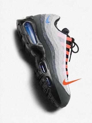 A grey, blue, and orange-colored Kith x Nike Air Max 95.