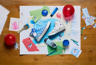 Different pairs of children's sneakers from the Bluey x Converse footwear and apparel collection.