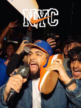 New York Knicks fan with the Knicks-inspired Nike NYC Air Force 1 in orange-and-blue.