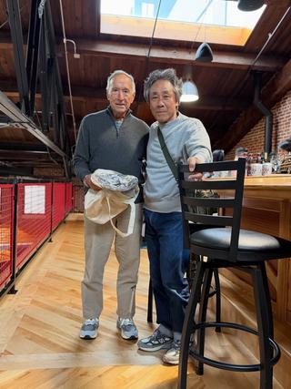 Jim Davis, Owner & Chairman of New Balance, wearing the 990v7 in a grey colorway. Photo by Satoshi Suzuki via @rfkenmore on X.