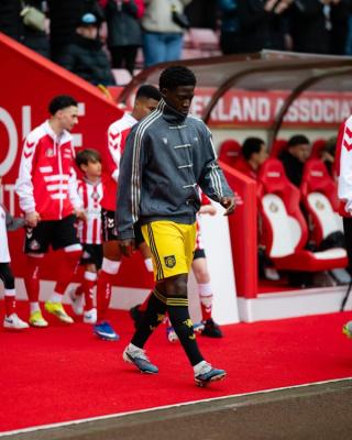 Manchester United players wearing custom viral adidas Chinese New Year Jacket in grey on May 9, 2026.