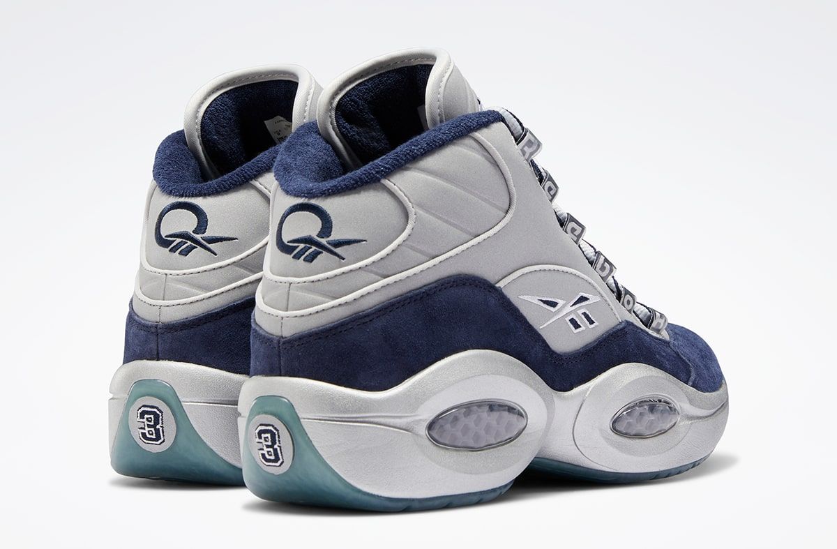 The Reebok Question Mid Returns in Core Black and Vector Blue