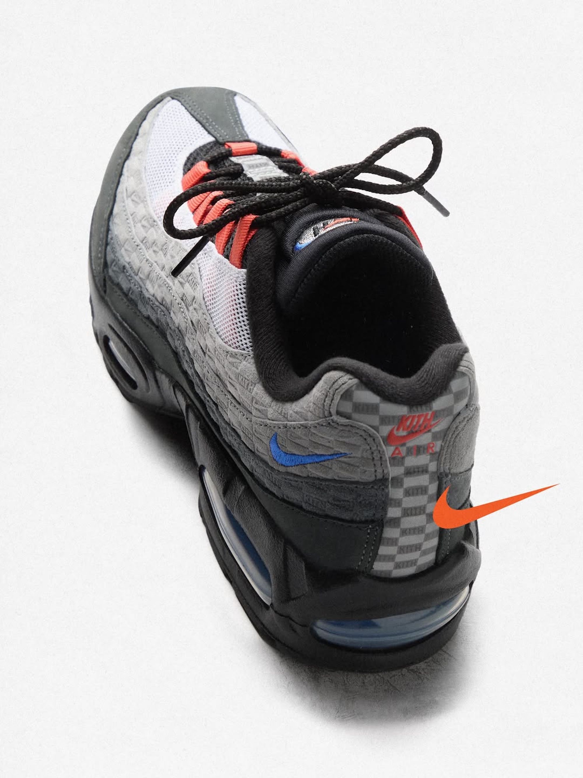 A grey, blue, and orange-colored Kith x Nike Air Max 95.