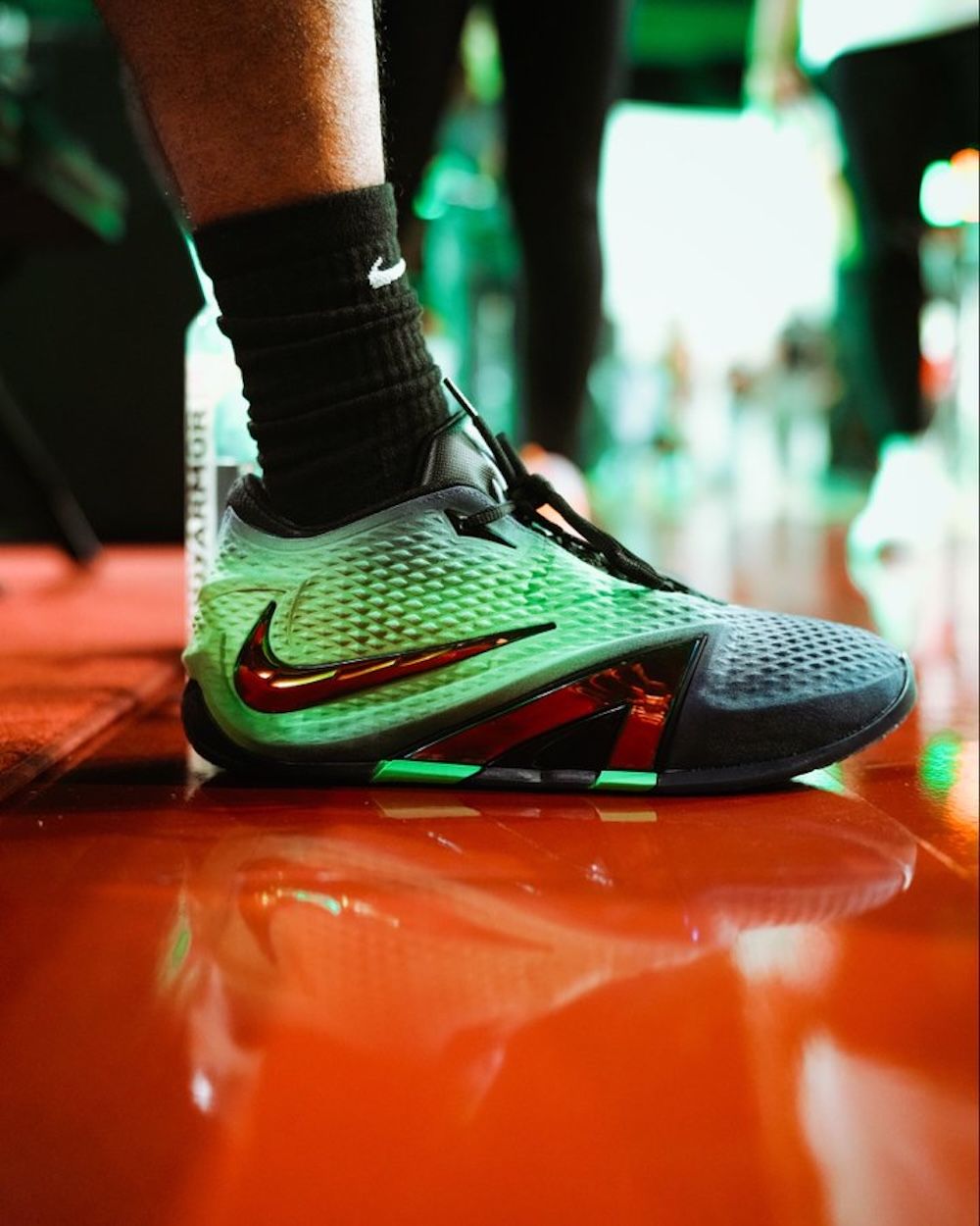 On-foot look of the Nike Ja 4 basketball shoe in a green-and-black colorway. Photo via Ja Morant.