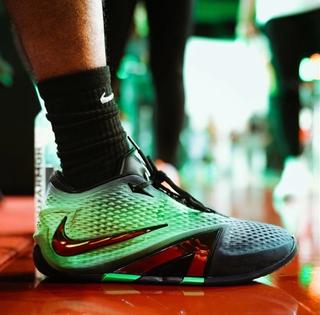 On-foot look of the Nike Ja 4 basketball shoe in a green-and-black colorway. Photo via Ja Morant.