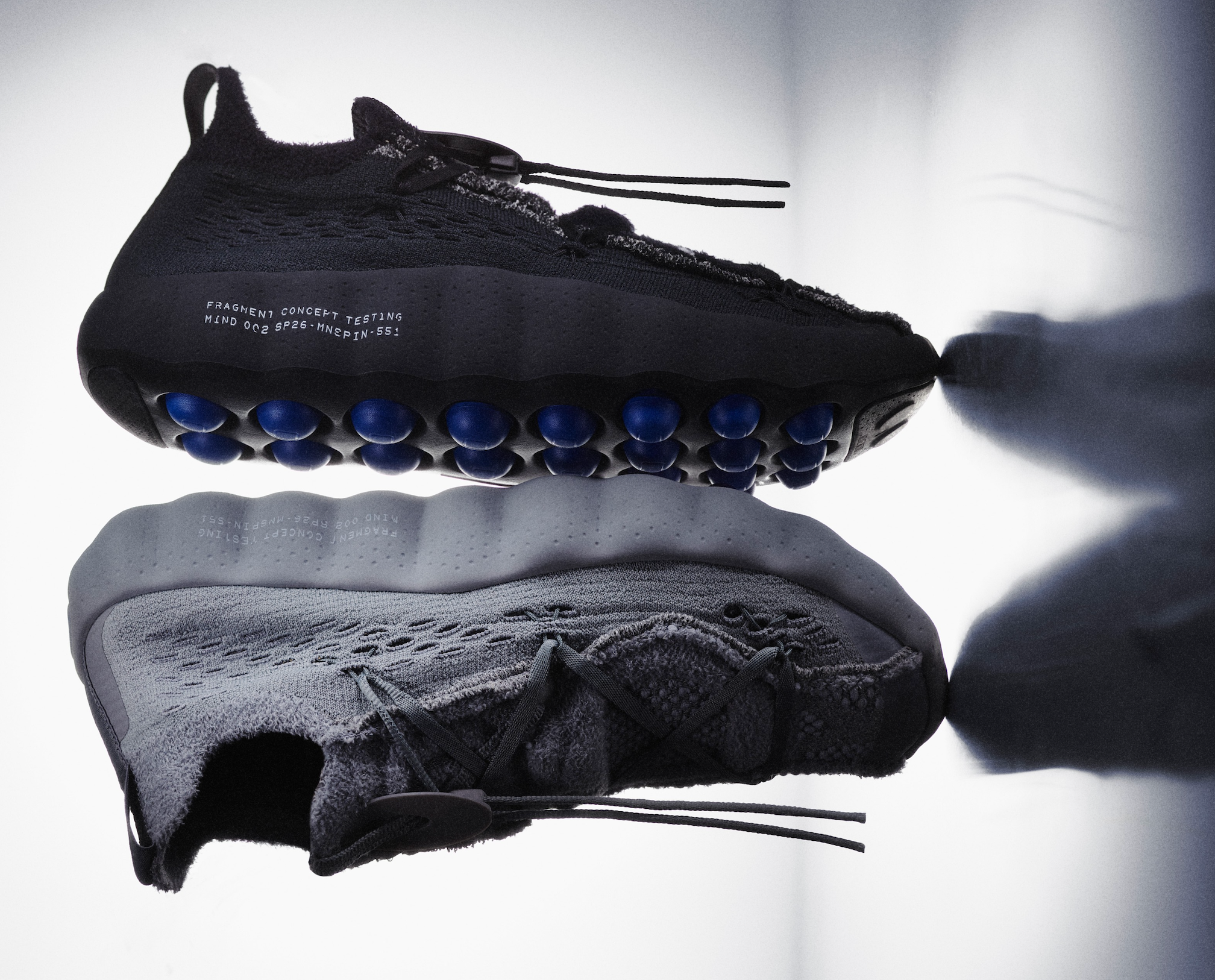 fragment design's Nike Mind 002 Shoe collaboration in a grey & black color schemes.