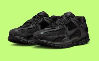 Nike's Zoom Vomero 5 in a "Black/Anthracite" color scheme complete with reflective profile overlays.