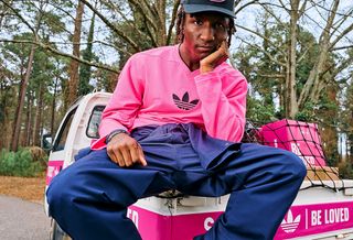 Twitch partner Raud wearing SNIPES' pink-covered "Be Loved" adidas AdiStar Control 5 collaboration.