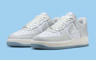 Nike's Air Force 1 Low in a "White/Light Armory Blue/Photon Dust" color scheme.