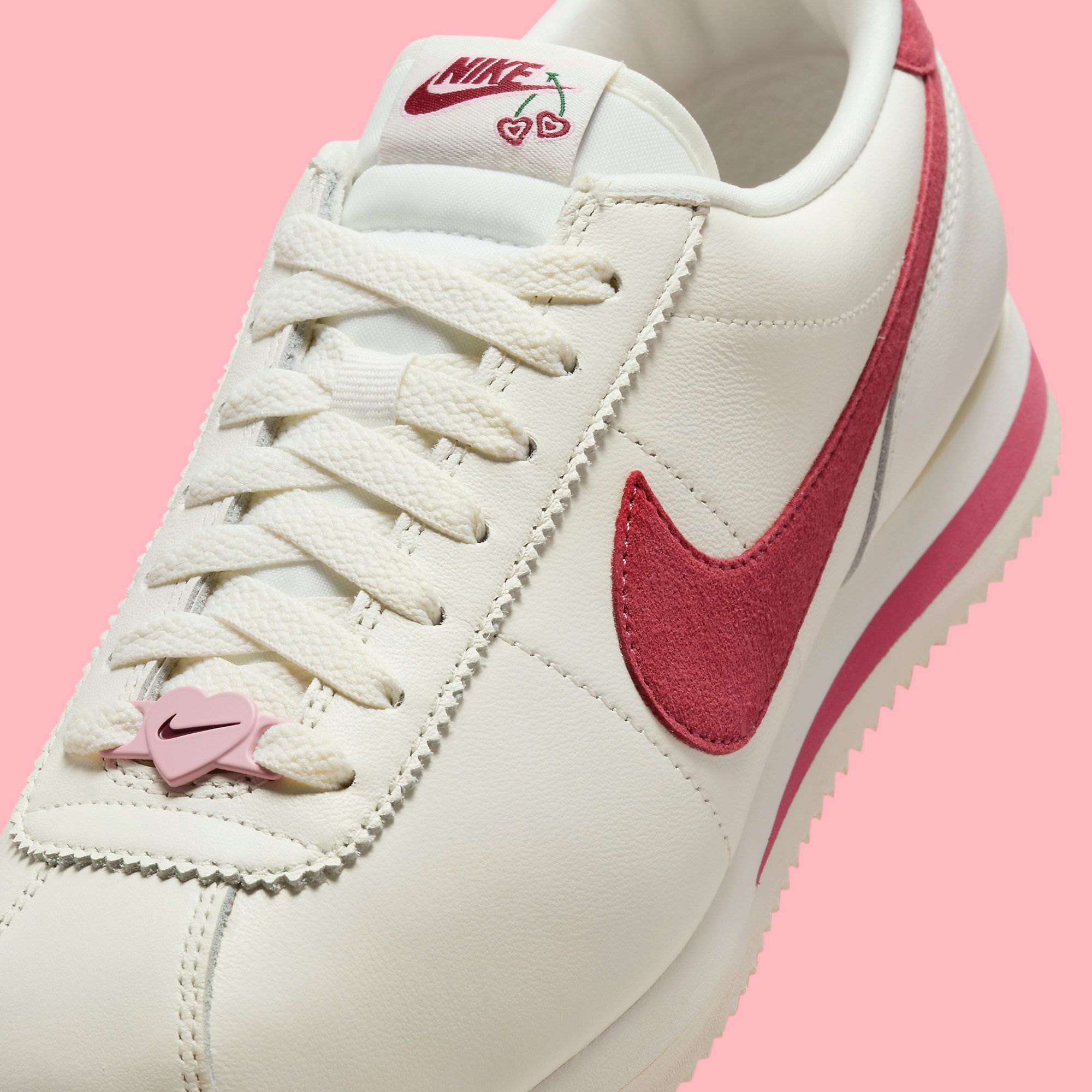 Nike cortez womens pink and white hotsell